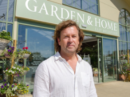 Blue Diamond CEO Alan Roper in front of a store