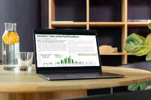 a laptop showing sales figures