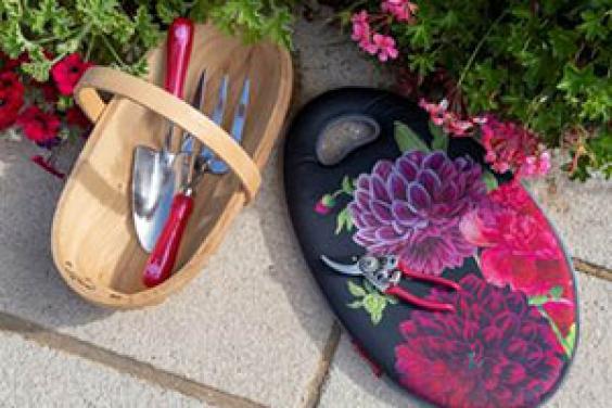 The Gifts For Gardeners Trowl, Kneel pad, and gloves in the British Bloom design